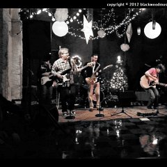 Danl sings &#34;Jingle Bell Rock, and Ashley Reynolds (center) of Monk&#39;s Wine joins us on saxophone